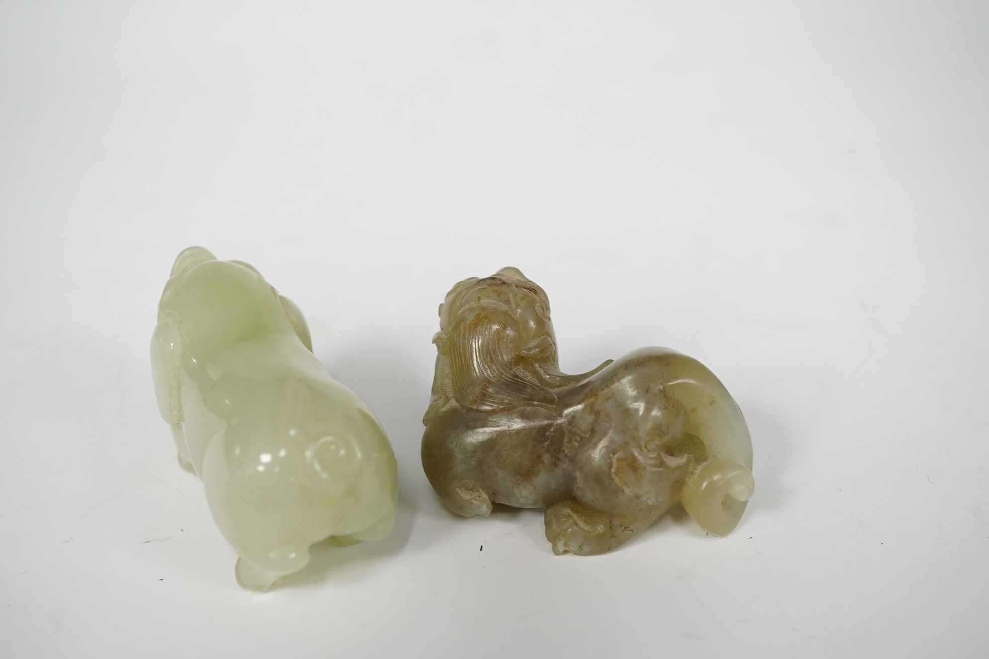 Two Chinese jade figures of animals including a pig, largest 5.5cm wide (2). Condition - good